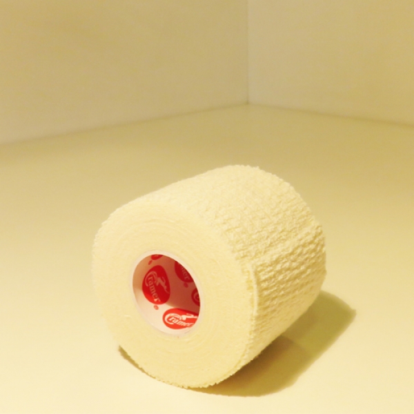 Front of zip tote bag with white canvas, black canvas straps and handle, and black zipper pulls.