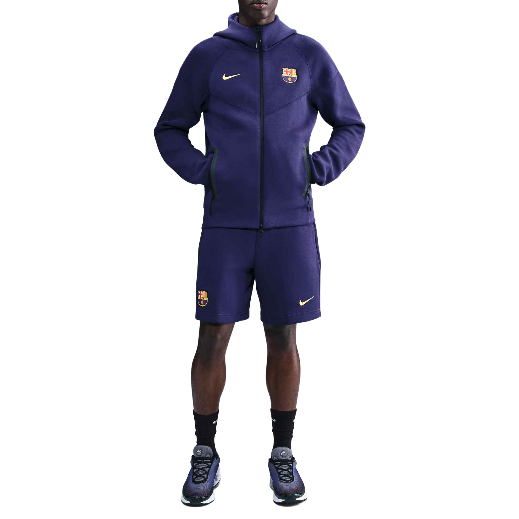 Front of zip tote bag with white canvas, black canvas straps and handle, and black zipper pulls.