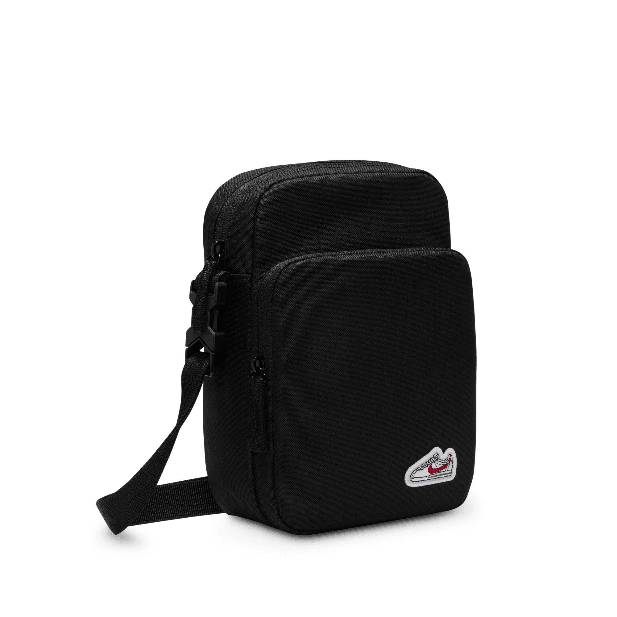 Front of zip tote bag with white canvas, black canvas straps and handle, and black zipper pulls.