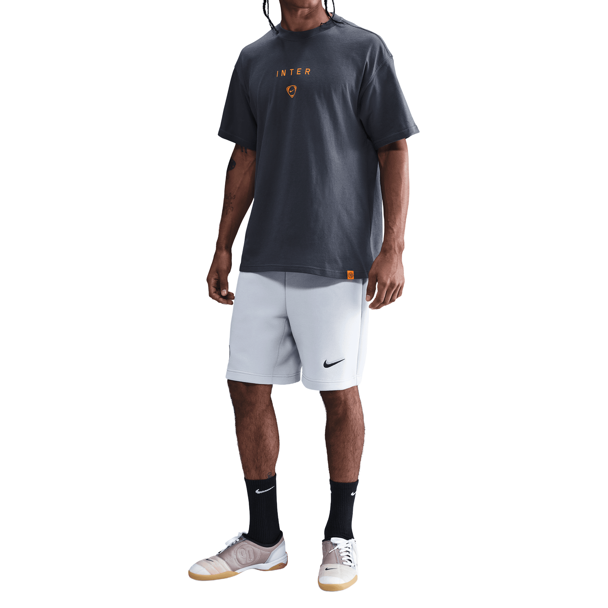 Front of zip tote bag with white canvas, black canvas straps and handle, and black zipper pulls.