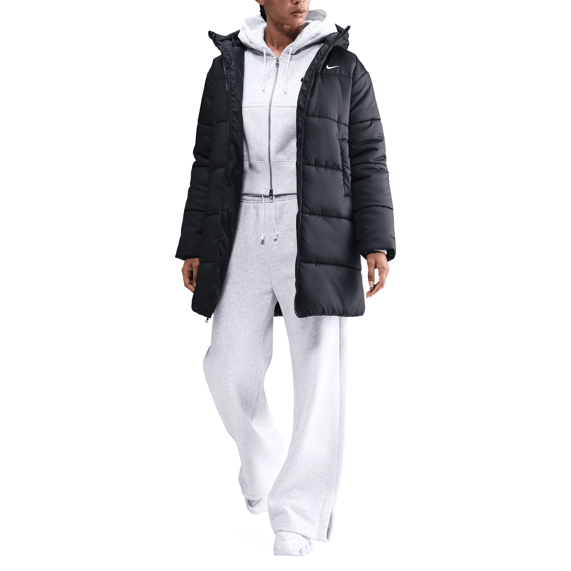 Front of zip tote bag with white canvas, black canvas straps and handle, and black zipper pulls.